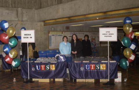 People with Posters, UTSC Flags and Press Kits, Media Sign in Station, Great Minds Campaign Event, the Meeting Place