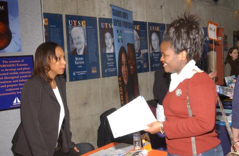 Student Speaks with Presenter at INROADS/Toronto, Volunteer Fair, the Meeting Place