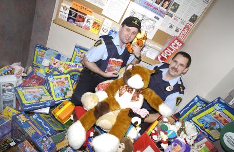 Two Campus Police Officers with Toys, Toy Drive, 2001