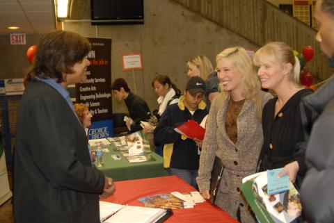 Students Speak with Presenter, Unidentified (Teaching Program) Table, Graduate and Professional Schools Fair, 2006, the Meeting Place