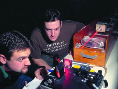 Two People Working with Laser