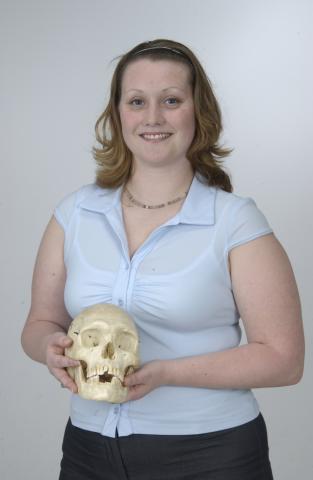 Student, Keesha Beauchamp, Anthopology Program, holding Skull, Promotional Image
