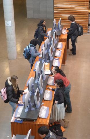 Students Using Standing Computers in Library Entrance Area, Library, ARC