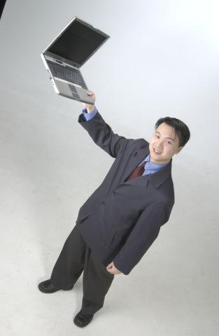 Desmond Kwan, with Laptop, Promotional Studio Image