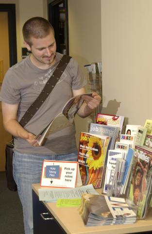 Accessibility Office, Student Viewing Promotional Materials, Promotional Image