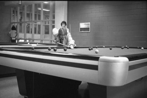 Student with Cigarette Lining Up Pool Shot