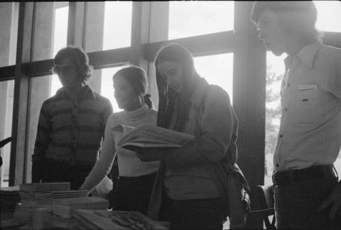 Group of Students Looking at Papers