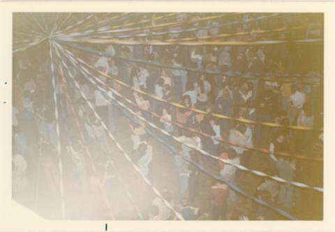 Students Dancing in Pairs Under Streamers in The Meeting Place