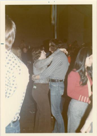 Two Students Dancing Arm-in-Arm in The Meeting Place