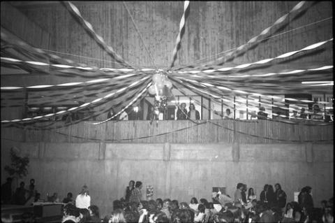 Streamers Hanging Above Seated Crowd in The Meeting Place