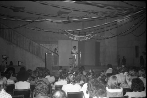 Student Onstage in Front of Crowd