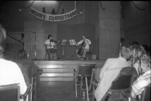 Students Playing Violin and Cello Onstage in The Meeting Place