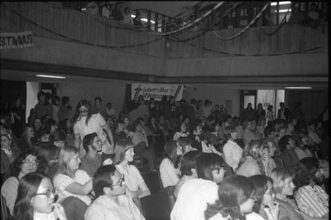 Students Sitting and Standing in Audience