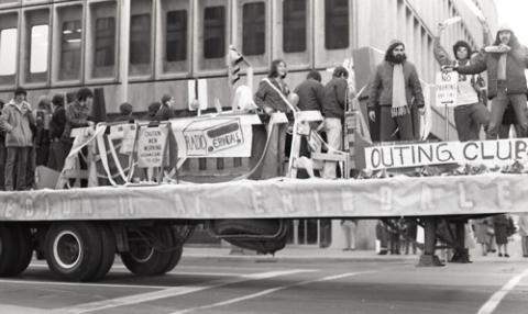 Students Standing on Float with Signs "Outing Club" and "Radio Erindale"