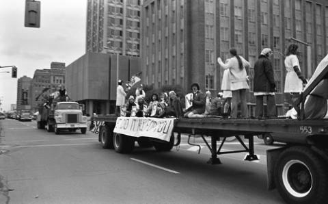 Students Sitting and Standing on nrusing Float in Homecoming Parade on Bloor Street
