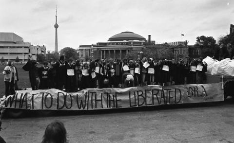 Students Standing on Float with Sign "What To Do With The Liberated Bra" in King's College Circle