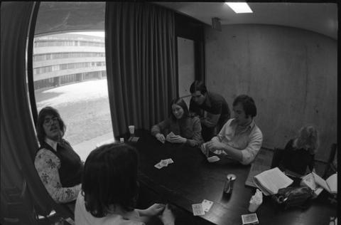 Students Playing Cards in The Meeting Place