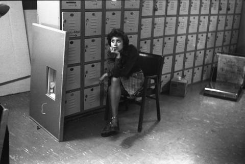Student Seated by Lockers