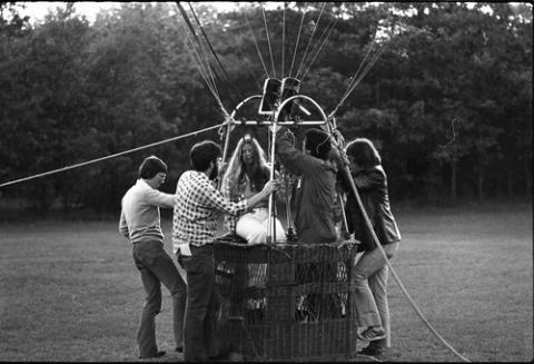 People Climbing into a Hot Air Balloon