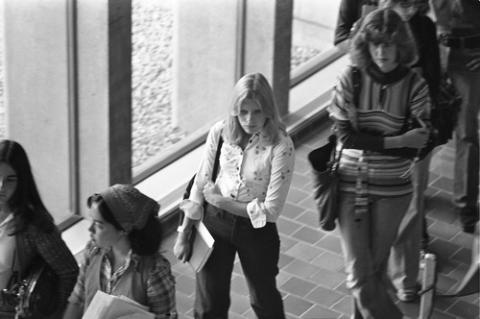 Student Standing in Line in Hallway by Registration Desks