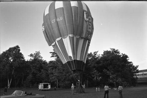 Hot Air Balloon Inflating in Field