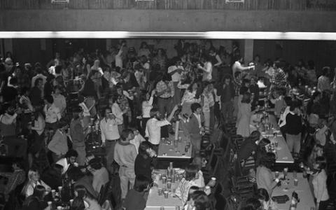 Crowd of Students Standing for a Toast in The Meeting Place