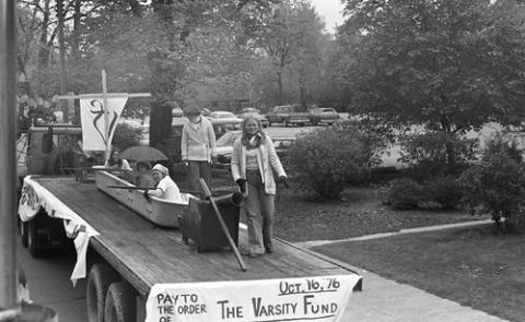 Students on Homecoming Float With Sign for 'The Varsity Fund'
