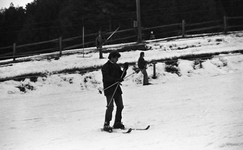 Student with Skis and Poles