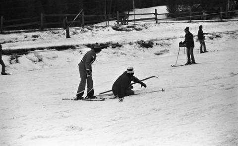 Student on Ground in Skis