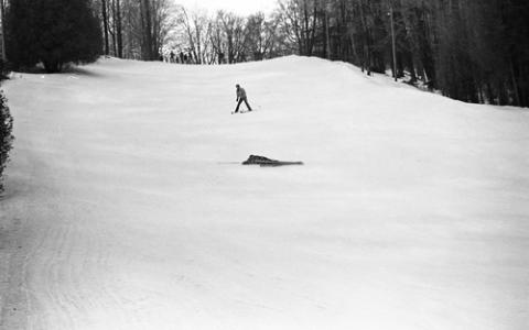 Student Laying on Ski Hill After Falling