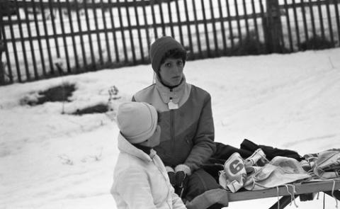 Student Seated on Bench with Ski Gear