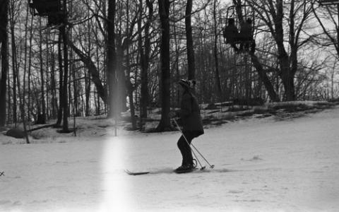 Student Skiing Past Trees