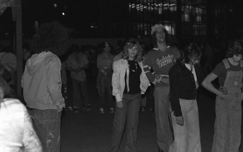 Group of Students Standing Outside at Night