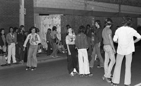 Students in Rollerskates Standing in Street