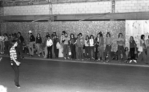 Students Standing on Sidewalk