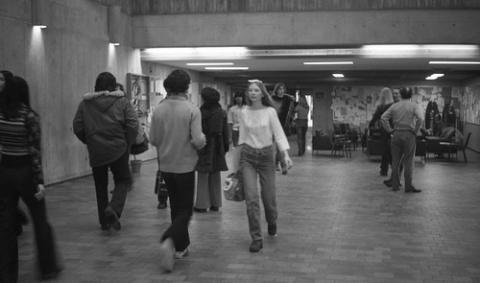 Students Walking Through The Meeting Place