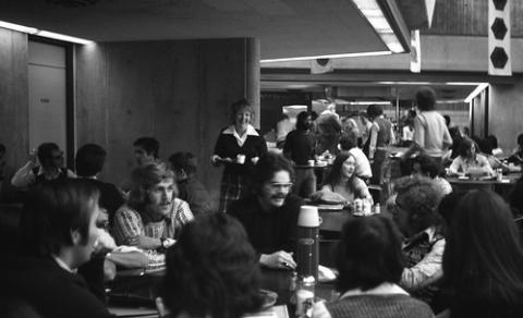 Crowd of Students Seated at Cafeteria Tables