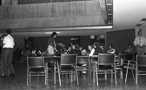 Students Seated at Tables in The Meeting Place
