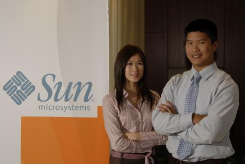 Two Co-op Students Stand beside Corporate Signage, Management and Economics Co-op Placement, Sun Microsystems, Inc., Promotional Image