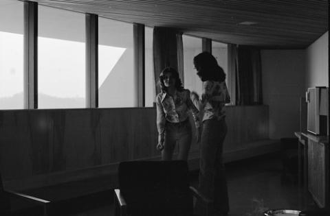 Two Students Talking in Hallway