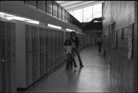 Three Students in Hallway