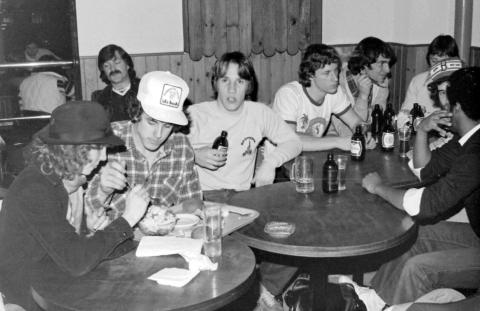 Group of Students Seated at Bar Tables