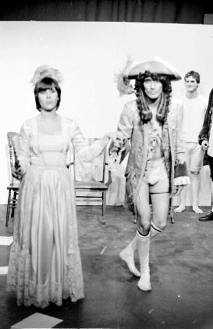 Two Costumed Students Bowing Onstage