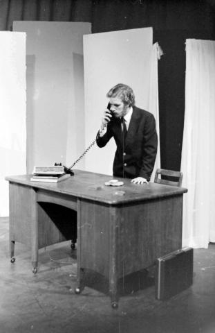Costumned Student Using Telephone Onstage